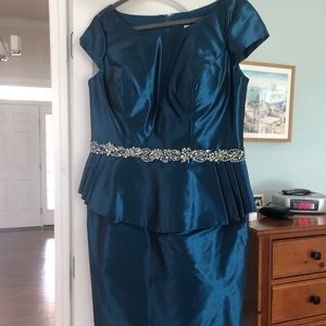 Size 16. Iridescent teal color/rhinestone accents.  Never worn. Originally $350